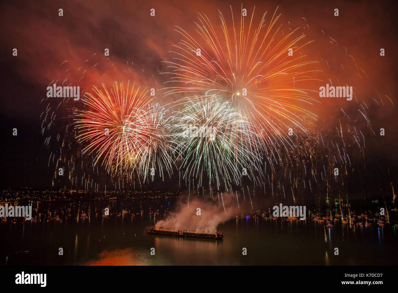 Colorful fireworks exploding at English Bay against sky Stock Photo