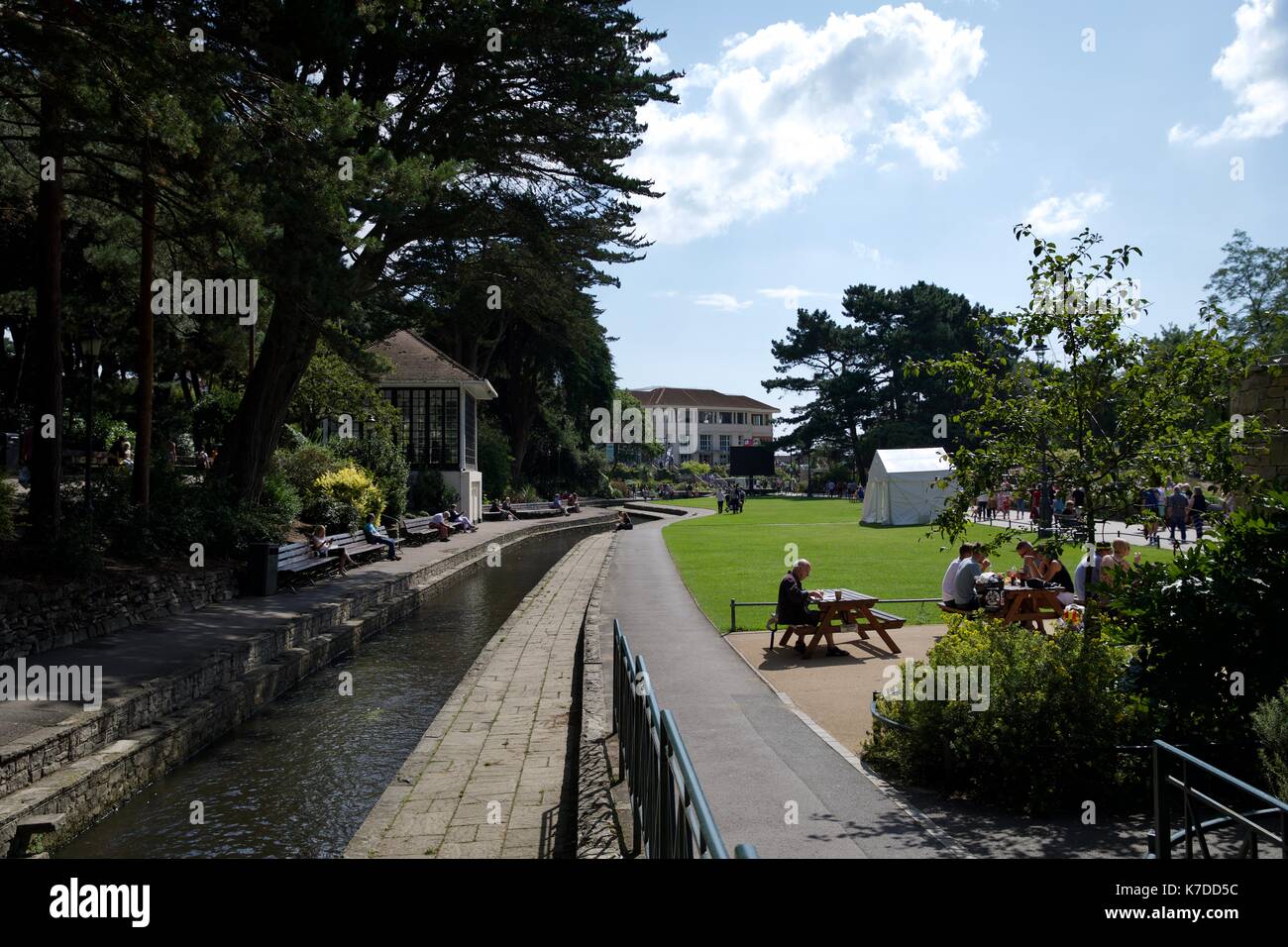 The River Bourne flowing through Bournemouth picturesque lower gardens Stock Photo