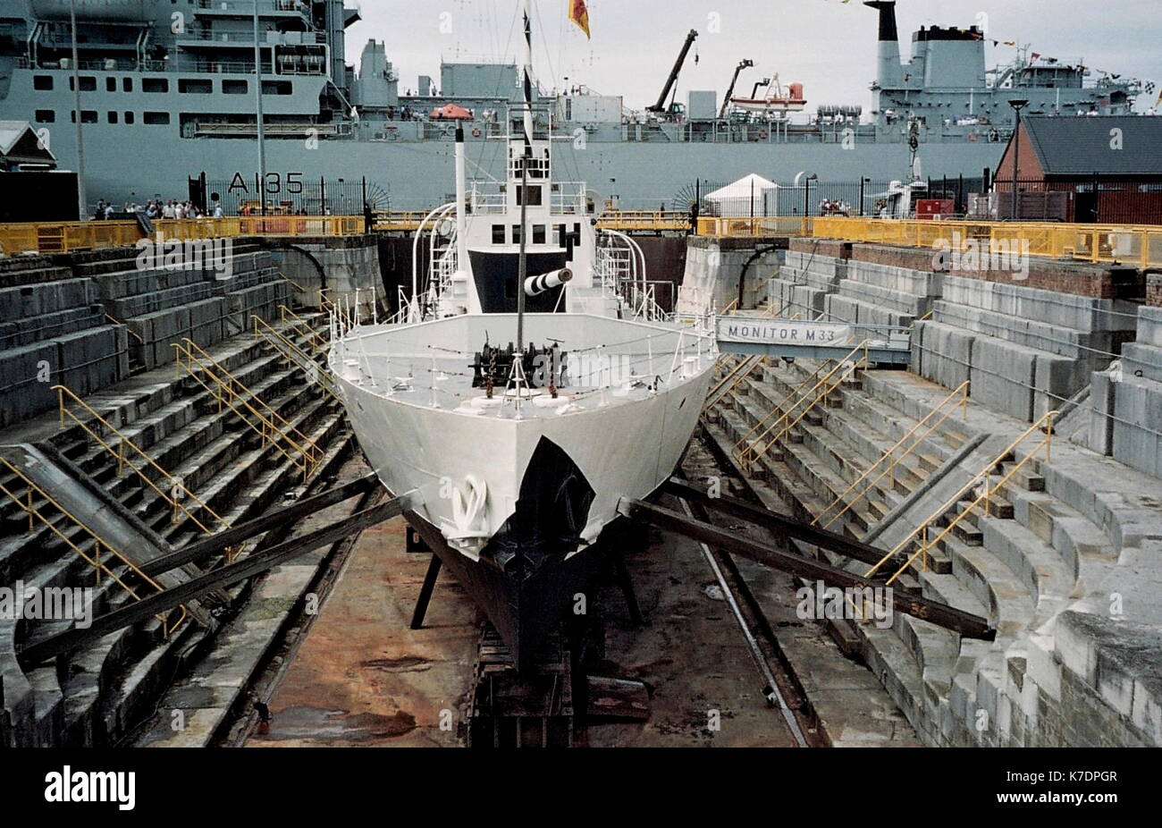 AJAXNETPHOTO. 30TH SEPTEMBER, 2010. PORTSMOUTH, ENGLAND. - HMS M.33 IN SCHEDULED ANCIENT MONUMENT NO.1 DRY DOCK IN THE HISTORIC DOCKYARD. PHOTO:JONATHAN EASTLAND/AJAX REF:APSX3009 04 4 Stock Photo