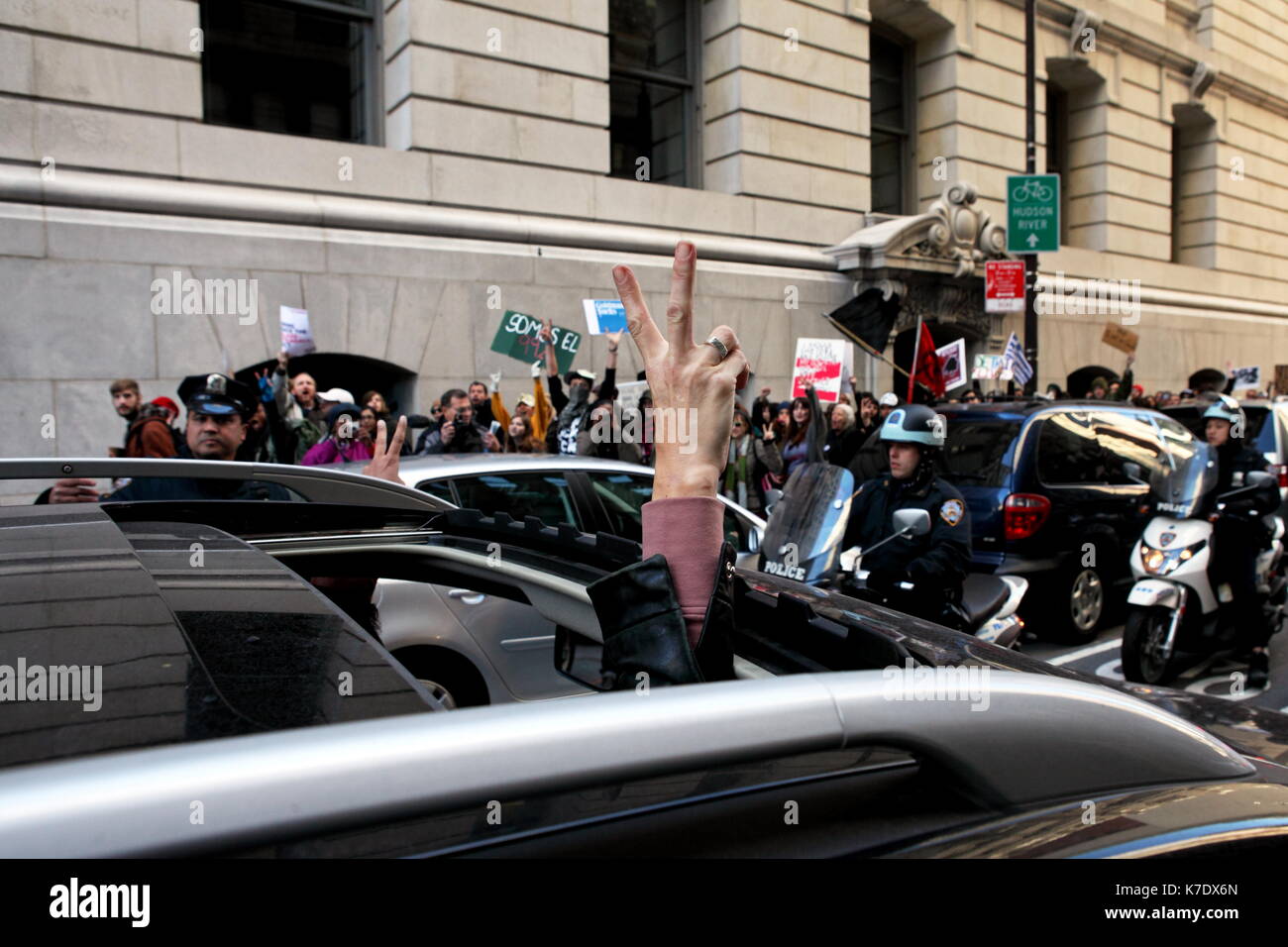 A passing motorist shows his solidarity with protestors marching from the Occupy Wall Street encampment at Zuccotti Park to the New York County Suprem Stock Photo