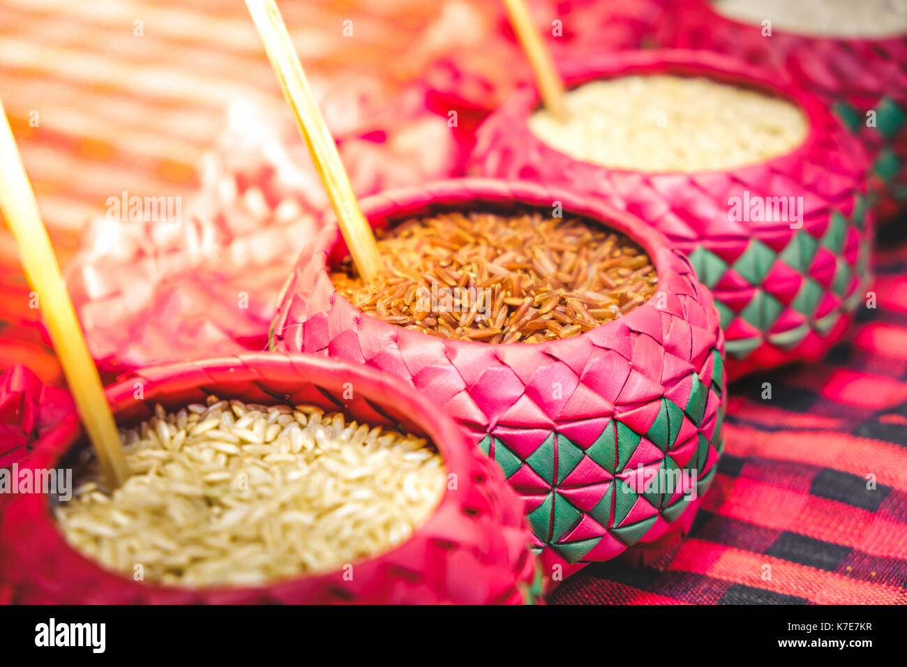 red rice purple bowl background whole grain rice various types of rice Stock Photo
