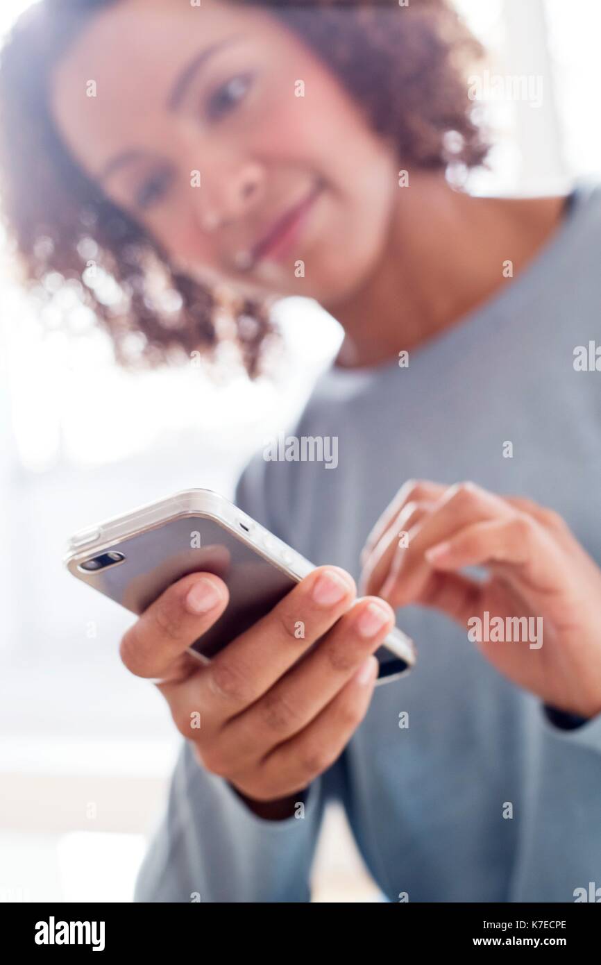 Mid adult woman texting hi-res stock photography and images - Alamy