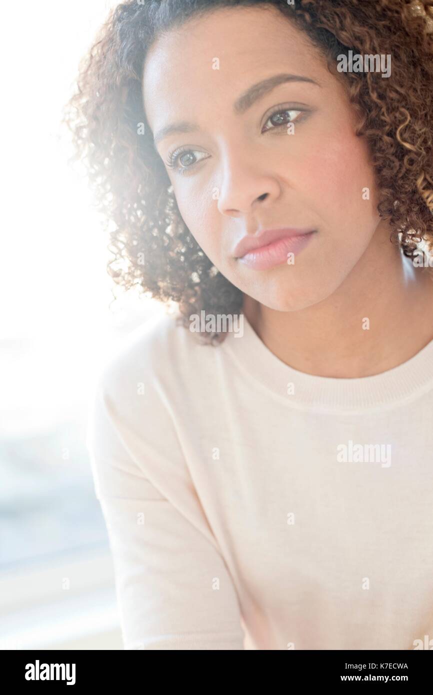 Mid adult woman looking away. Stock Photo