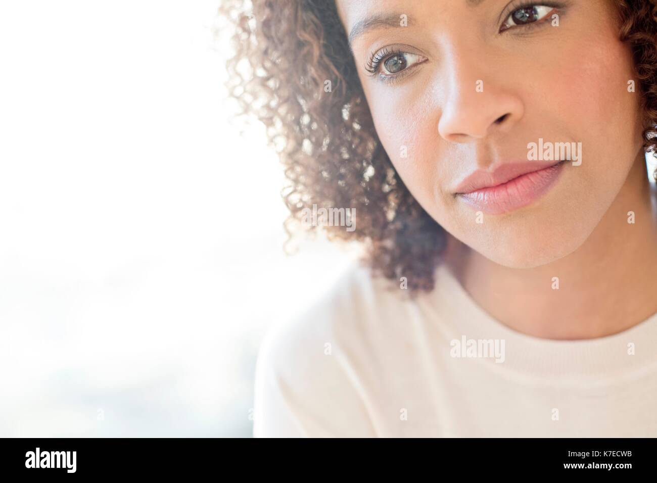 Mid adult woman looking away. Stock Photo