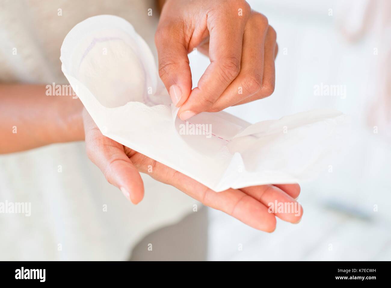 Woman holding sanitary towel. Stock Photo