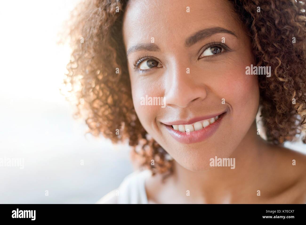 Portrait of mid adult woman smiling. Stock Photo