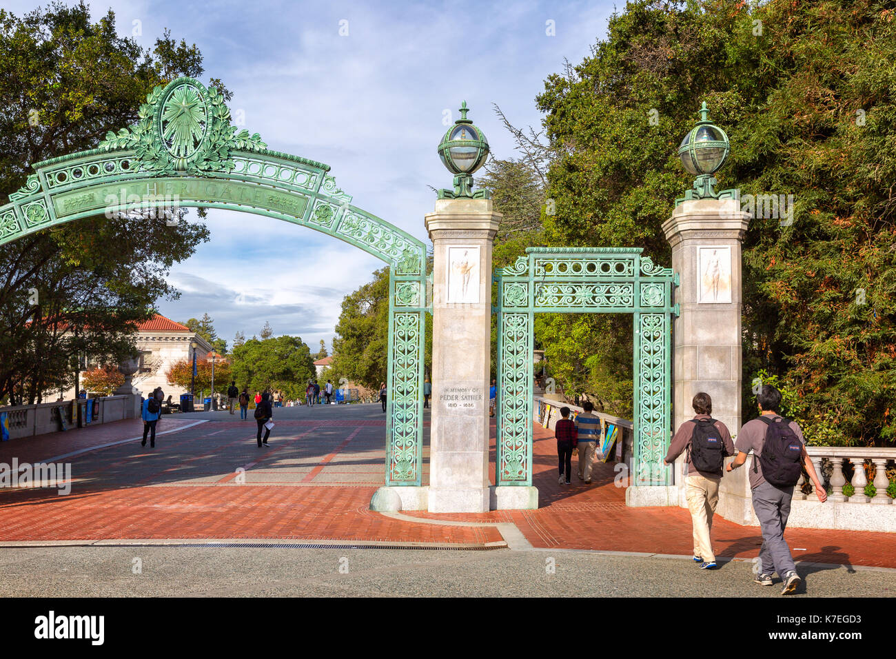 University of California at Berkeley main entrance into the campus, Sather Gate. Students are shown walking under the historical landmark Stock Photo