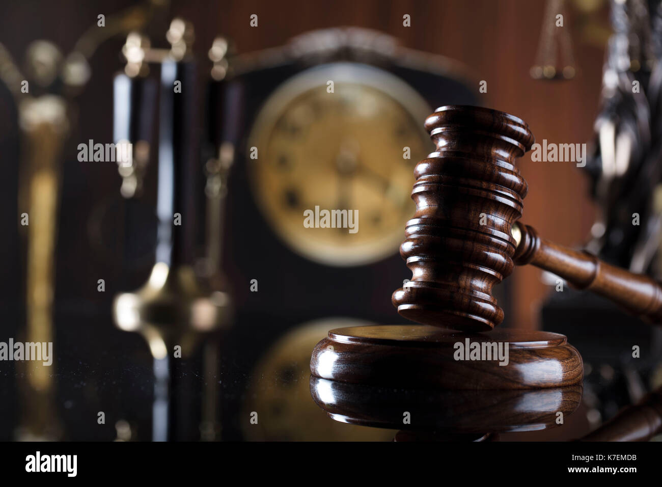 Old library. Vintage clock. Statue of justice and gavel. Law concept
