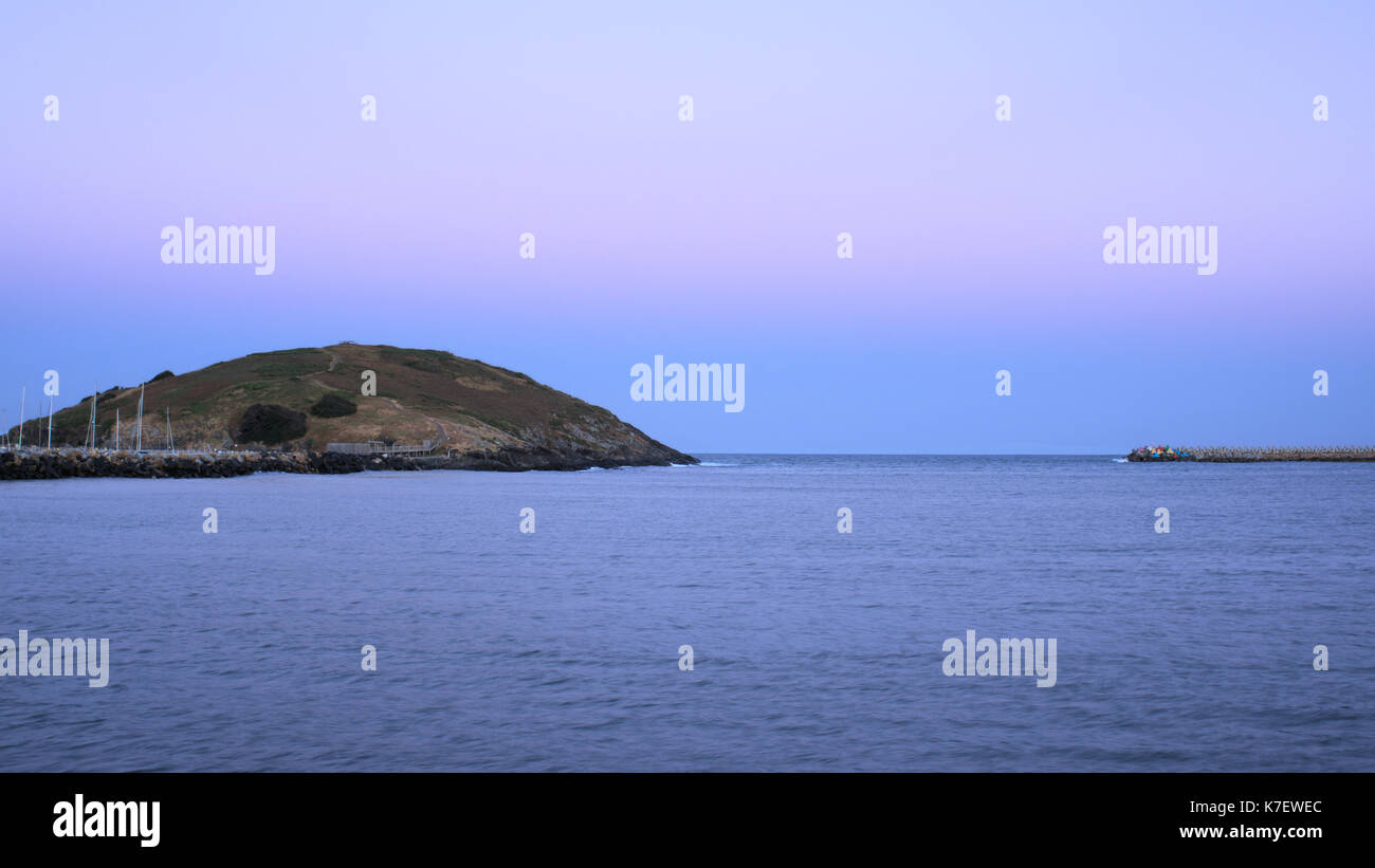 Muttonbird island, major Australian landmark and tourist attraction in Coffs Harbour in New South Wales under evening sky Stock Photo