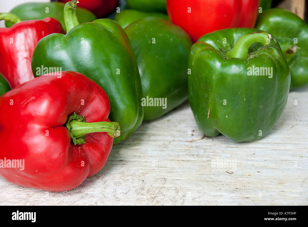 whole red and green peppers at the food market Stock Photo - Alamy