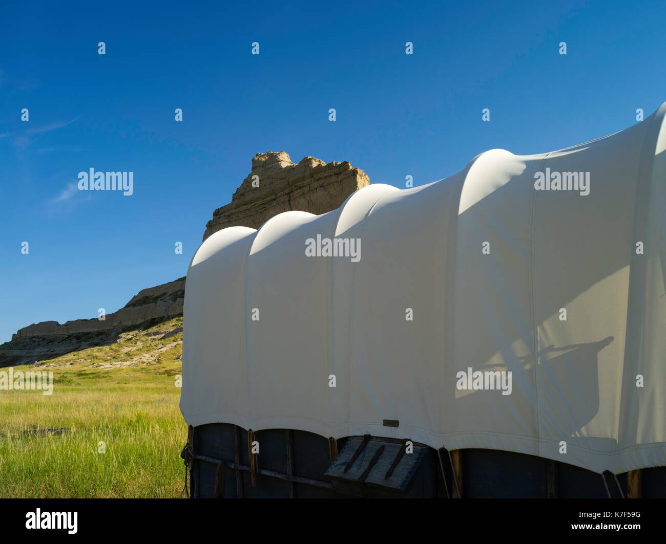 A recreated covered wagon sits in front of the Scottsbluff National ...