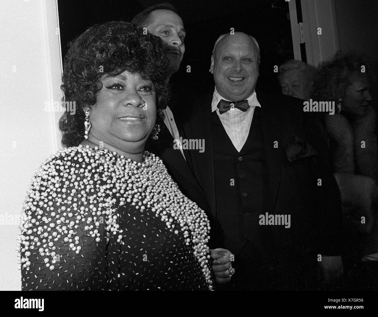 Baltimore, MD February 16, 1988 Singer, Ruth Carter appears with  Divine (Harris Glen Milstead) on the far right wth director, John Waters in the middle, at the premiere of the orginial movie, 'Hairspray'  Divine died six weeks after the premiere.  Credit: Patsy Lynch/MediaPunch Stock Photo