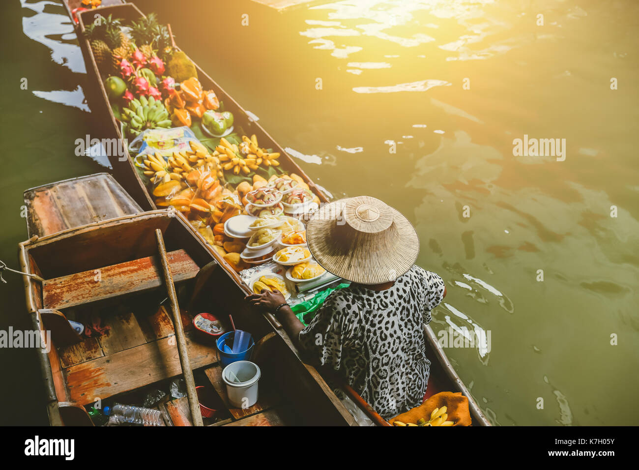 Fruit boat sale at Damnoen Saduak floating market. Damnoen Saduak is a popular travel tourist destination. Stock Photo