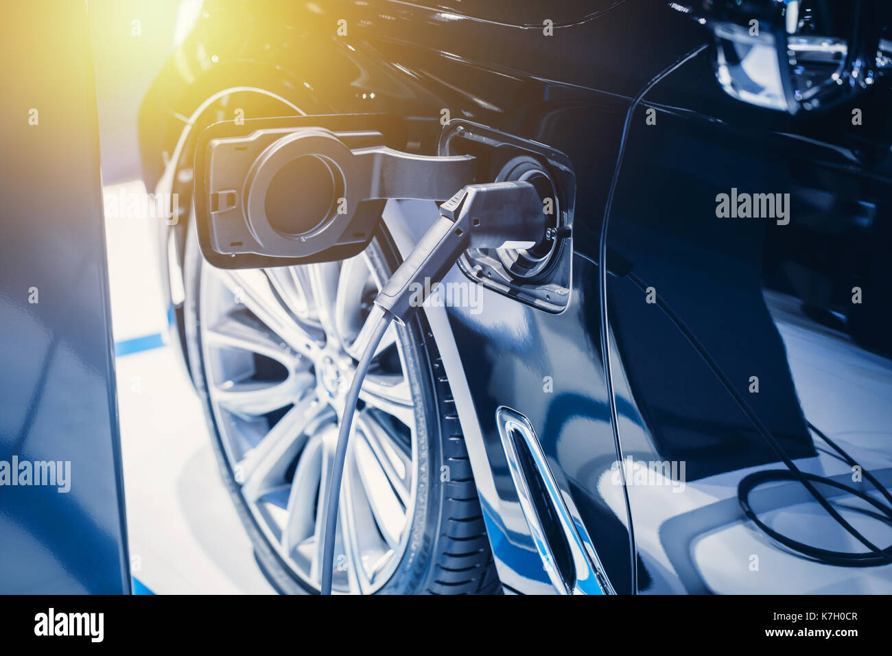 New era of vehicle fuel charge. Battery Power charging of blue modern electric car Stock Photo