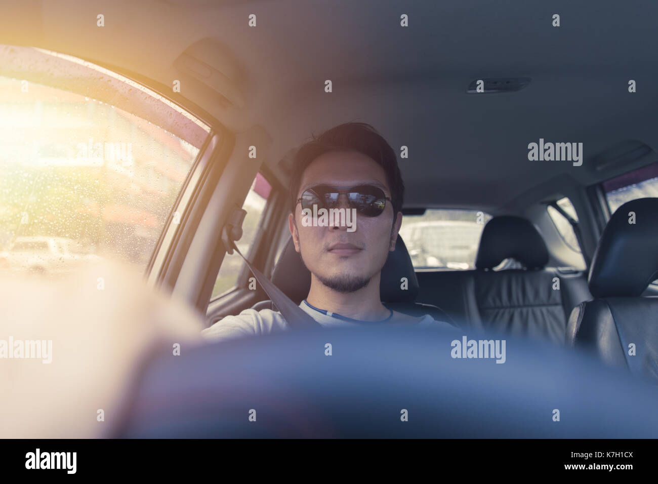 Handsome indian man driving car hi-res stock photography and images - Alamy