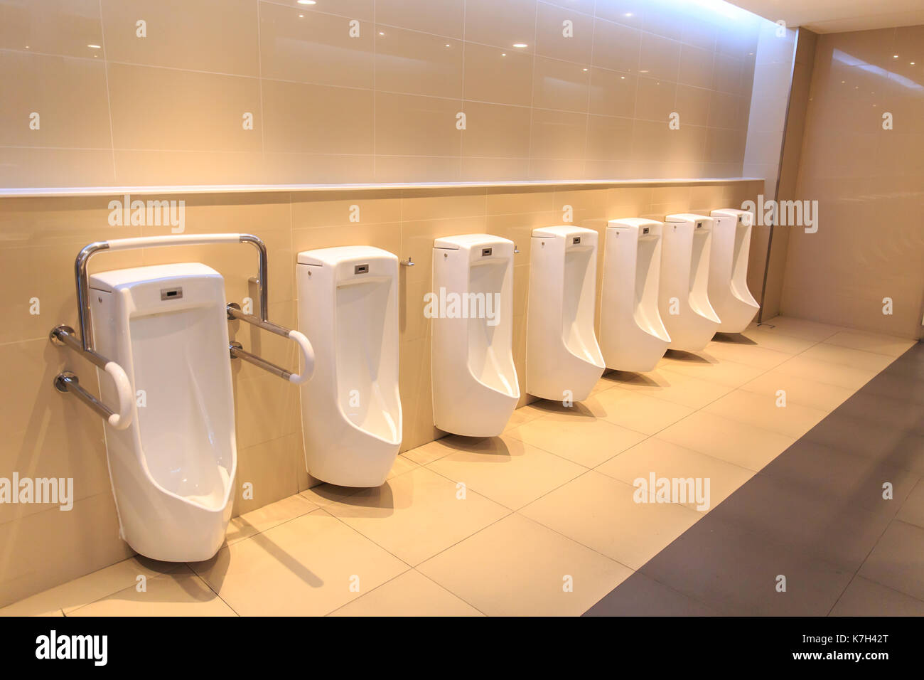 Clean Toilet urine sink row. New modern Toilet bowl in Hotel bathroom