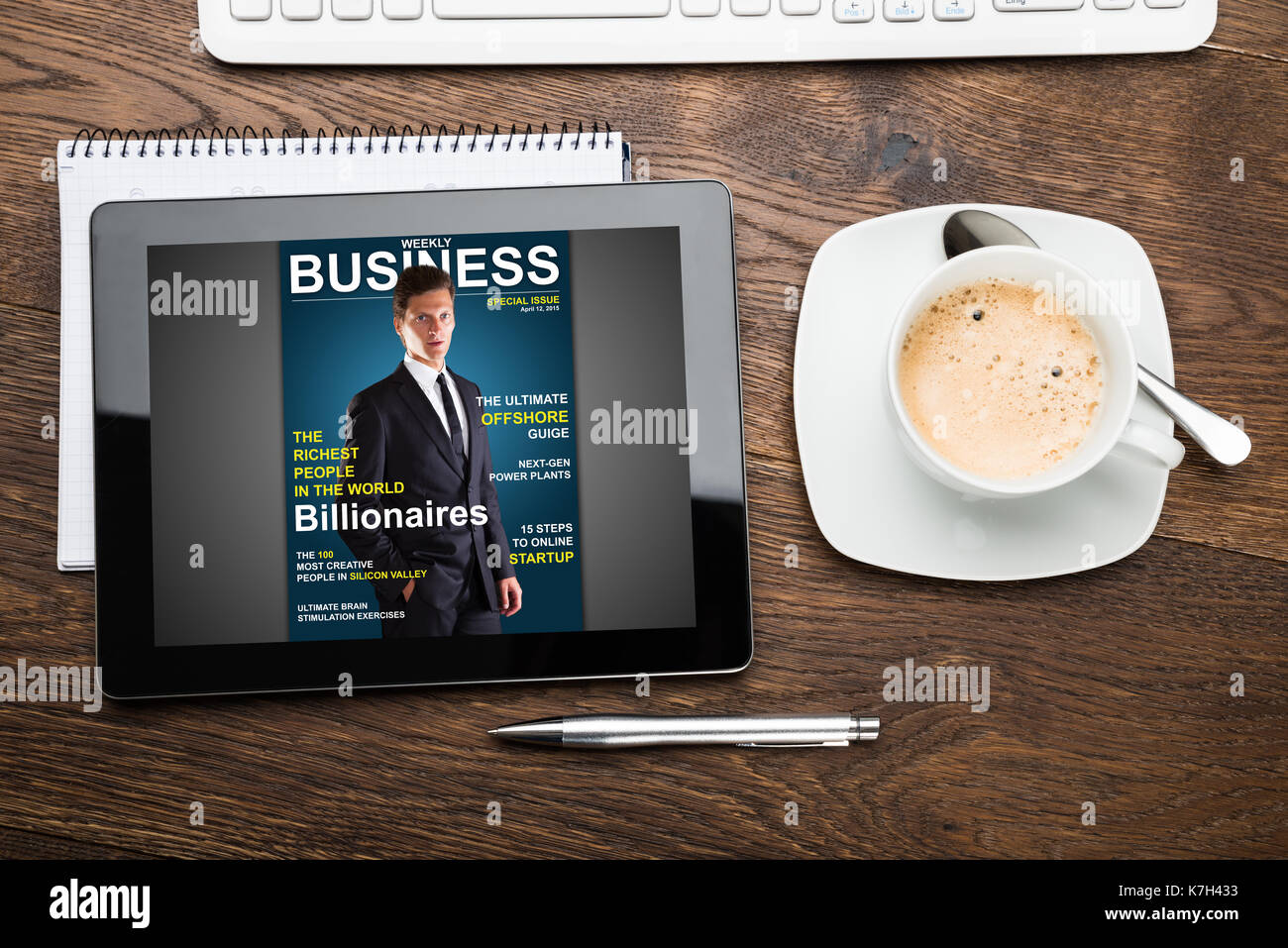 High Angle View Of Digital Tablet Showing Magazine Cover Stock Photo