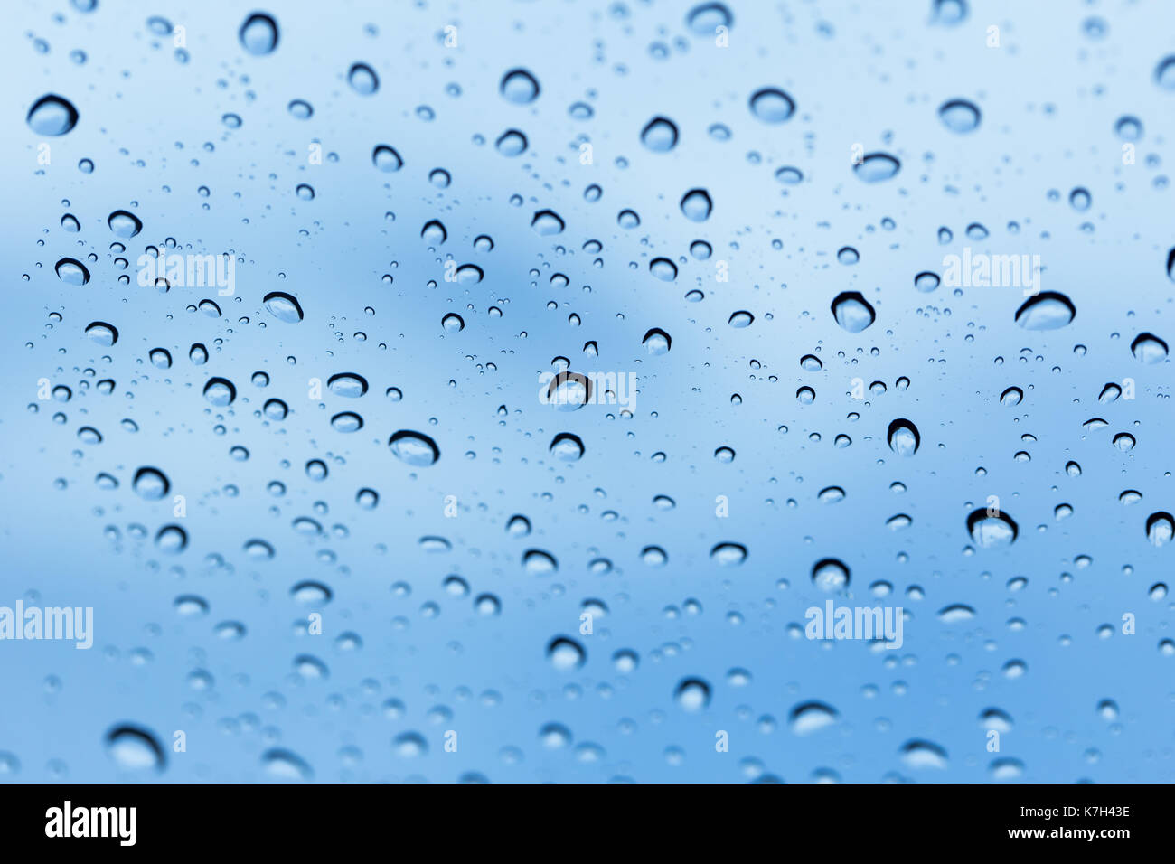 rain water drops with blur blue sky background Stock Photo - Alamy