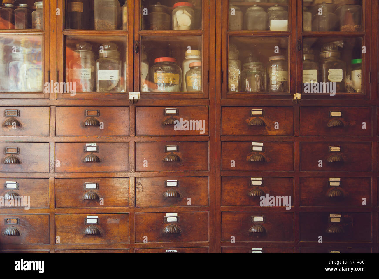 old herbal medical shop retro Chinese style seasoning collection wood cabinet in herb store. Stock Photo