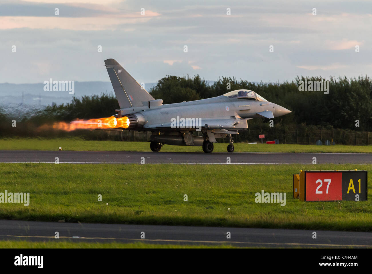 Performance takeoff by a Royal Air Force Typhoon FGR4 from Liverpool John Lennon airport during an autumn evening in 2017. Stock Photo