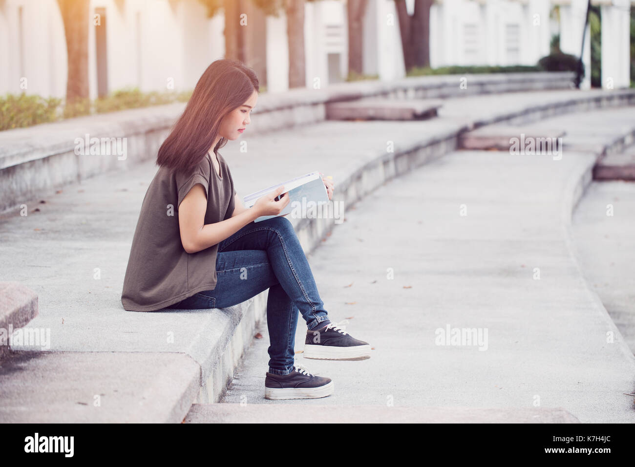 Asian teen women reading book happiness and smile enjoy education in university. Stock Photo