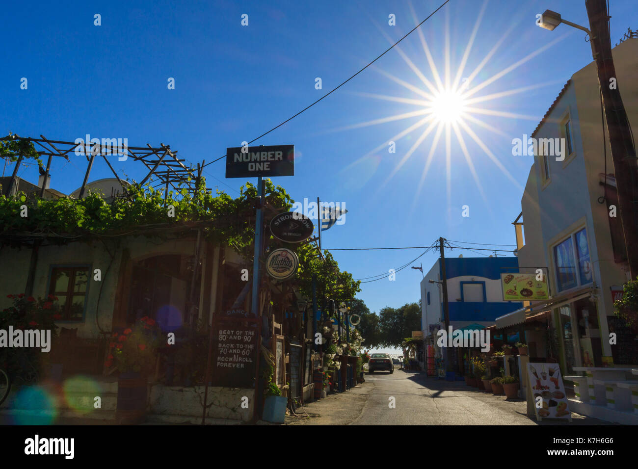 Village street with sun flare. Stock Photo