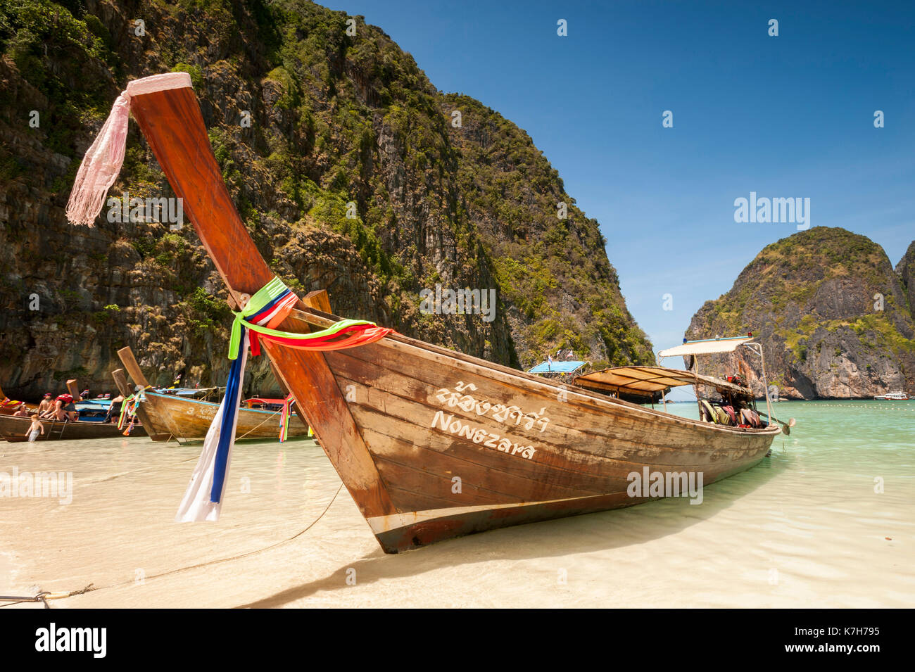 Long-tail boats in Maya Bay, Phi Phi Islands, Thailand. Stock Photo