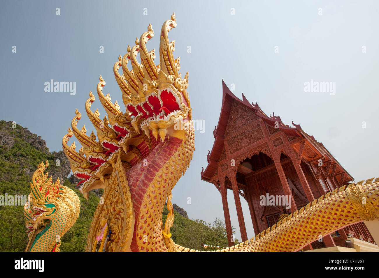 Colourful nine-headed nagas protecting the entrance of the Teak wood temple Wat Ao Noi, Prachuap Khiri Khan, Thailand, Southeast Asia Stock Photo