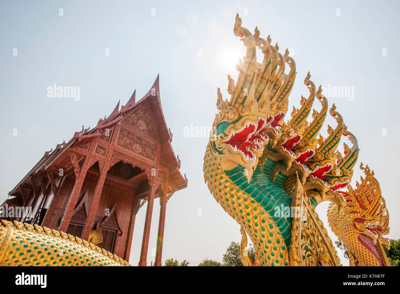 Colourful nine-headed nagas protecting the entrance of the Teak wood temple Wat Ao Noi, Prachuap Khiri Khan, Thailand, Southeast Asia Stock Photo