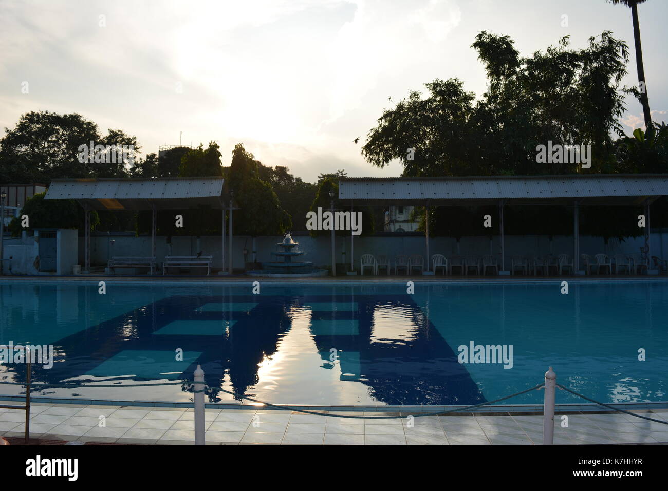 Kolkata weather. Warm pool side sunset on a day of mild humidity, cool breeze. Stock Photo