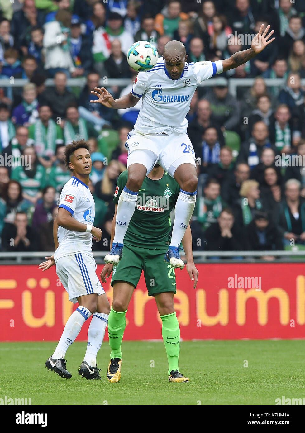 Bremen, Germany. 16th Sep, 2017. Schalke's Naldo reaches the ball with his head before Werder's Ishak Belfodil during the German Bundesliga soccer match between Werder Bremen and FC Schalke 04 in the Weserstadion in Bremen, Germany, 16 September 2017. (EMBARGO CONDITIONS - ATTENTION: Due to the accreditation guidelines, the DFL only permits the publication and utilisation of up to 15 pictures per match on the internet and in online media during the match.) Photo: Carmen Jaspersen/dpa/Alamy Live News Stock Photo