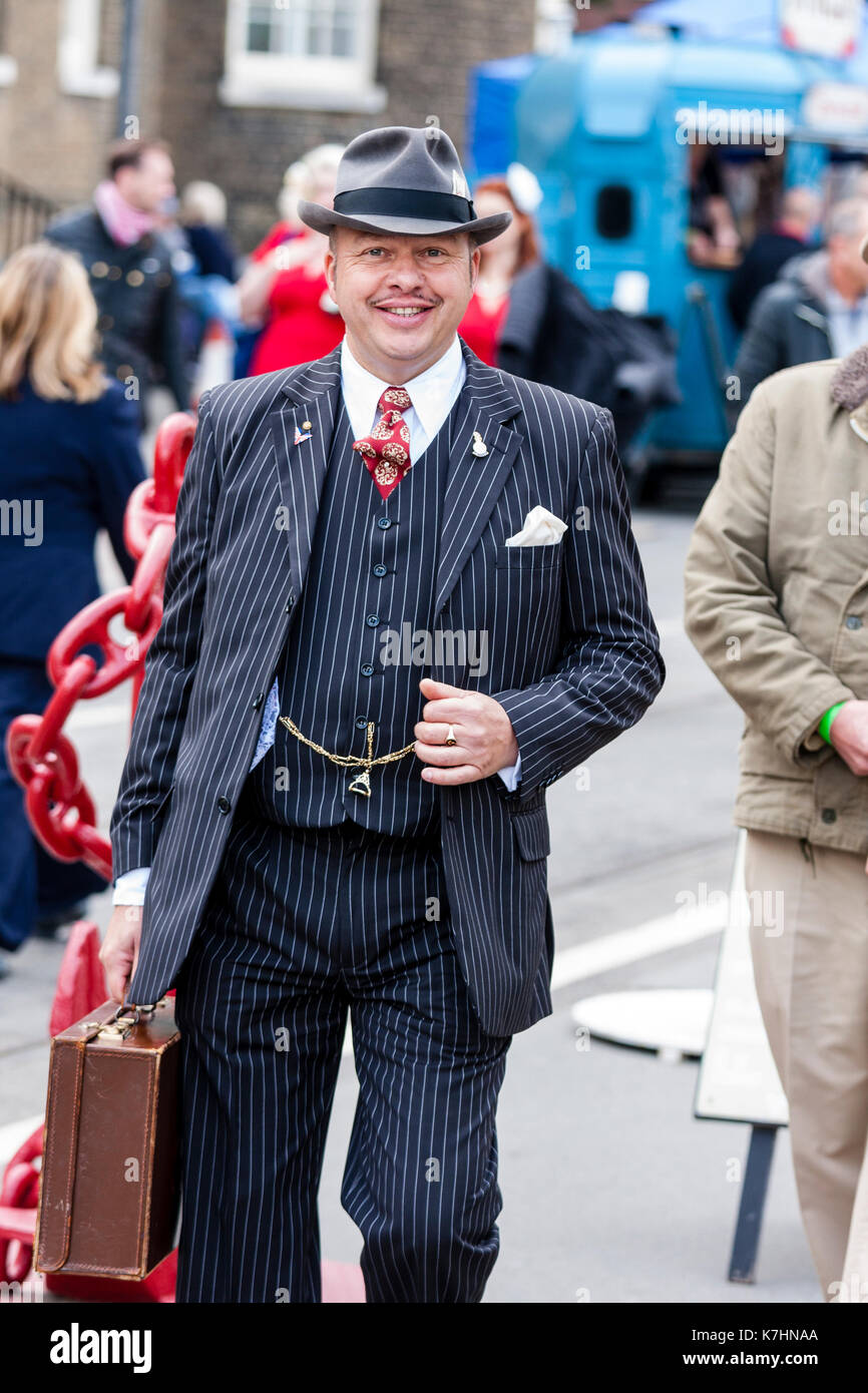 England, Chatham Dockyard. Yearly Salute to the forties event. Smiling man, reenactor, dressed as typical wartime spiv in three piece suit. Stock Photo