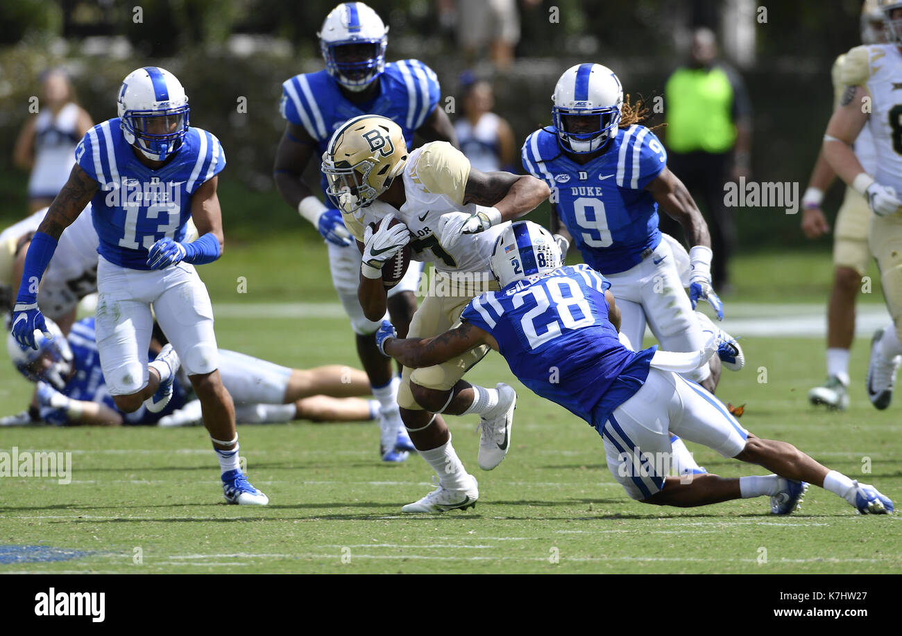 Durham, North Carolina, USA. 16th Sep, 2017. John Lovett (7) of Baylor carries the ball against Jordan Hayes (13) and Mark Gilbert (28) of Duke. The Duke Blue Devils played the Baylor Bears in a football game that took place on the Brooks Field at Wallace Wade Stadium in Durham, N.C. on Saturday, September 16, 2017. Duke won 34-20. Credit: Fabian Radulescu/ZUMA Wire/Alamy Live News Stock Photo