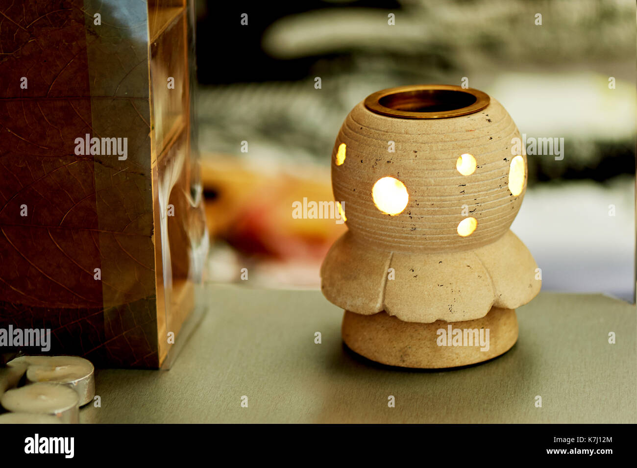 Candle holder sand color closed forms for the candles,the first Stock Photo Alamy