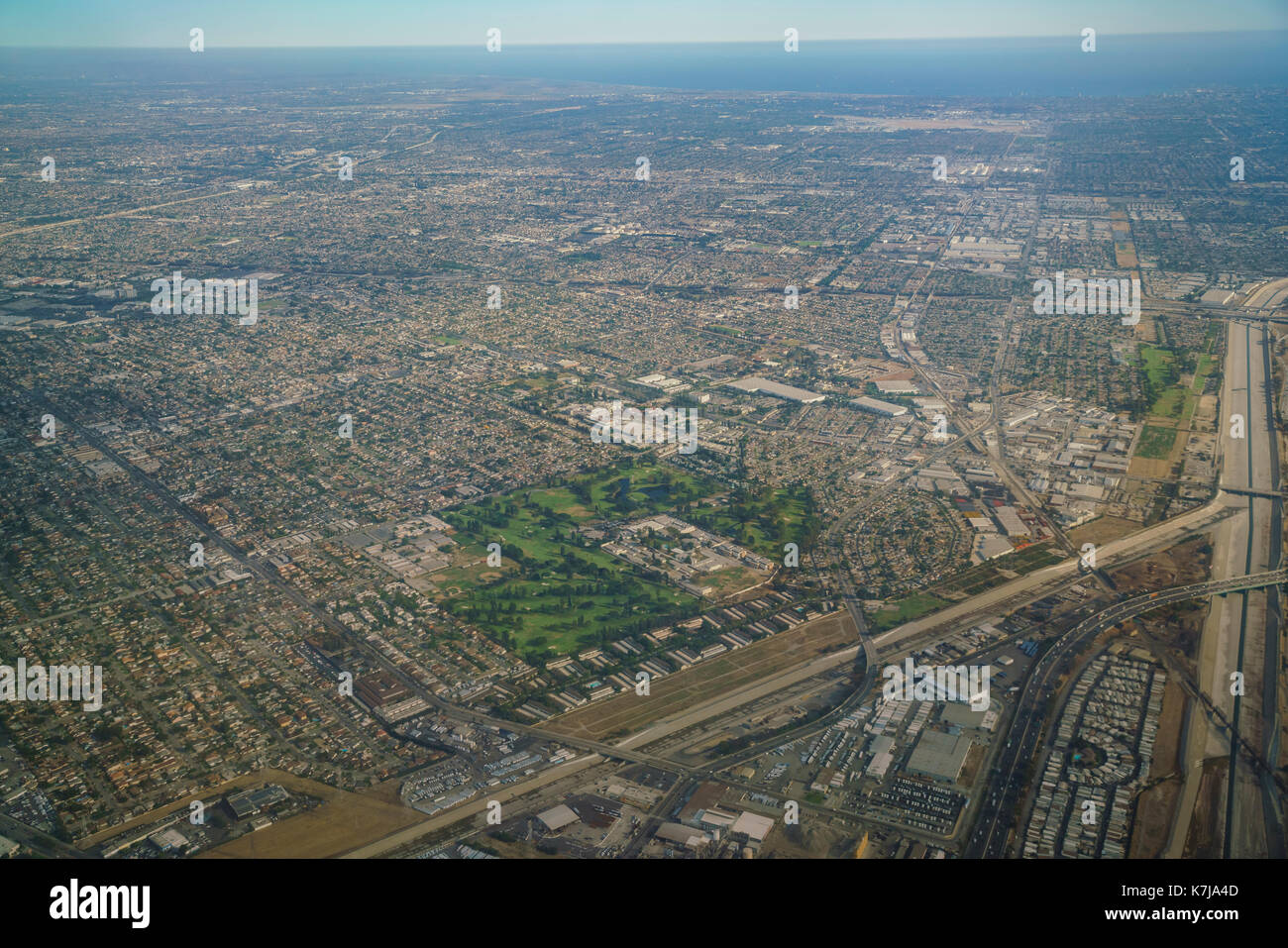 Aerial view of Downey and golf course, view from window seat in an