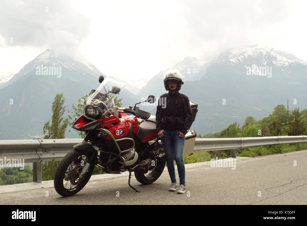 Young woman traveling with a red BMW GS R 1200 Adventure motorcycle in Italy Stock Photo Alamy