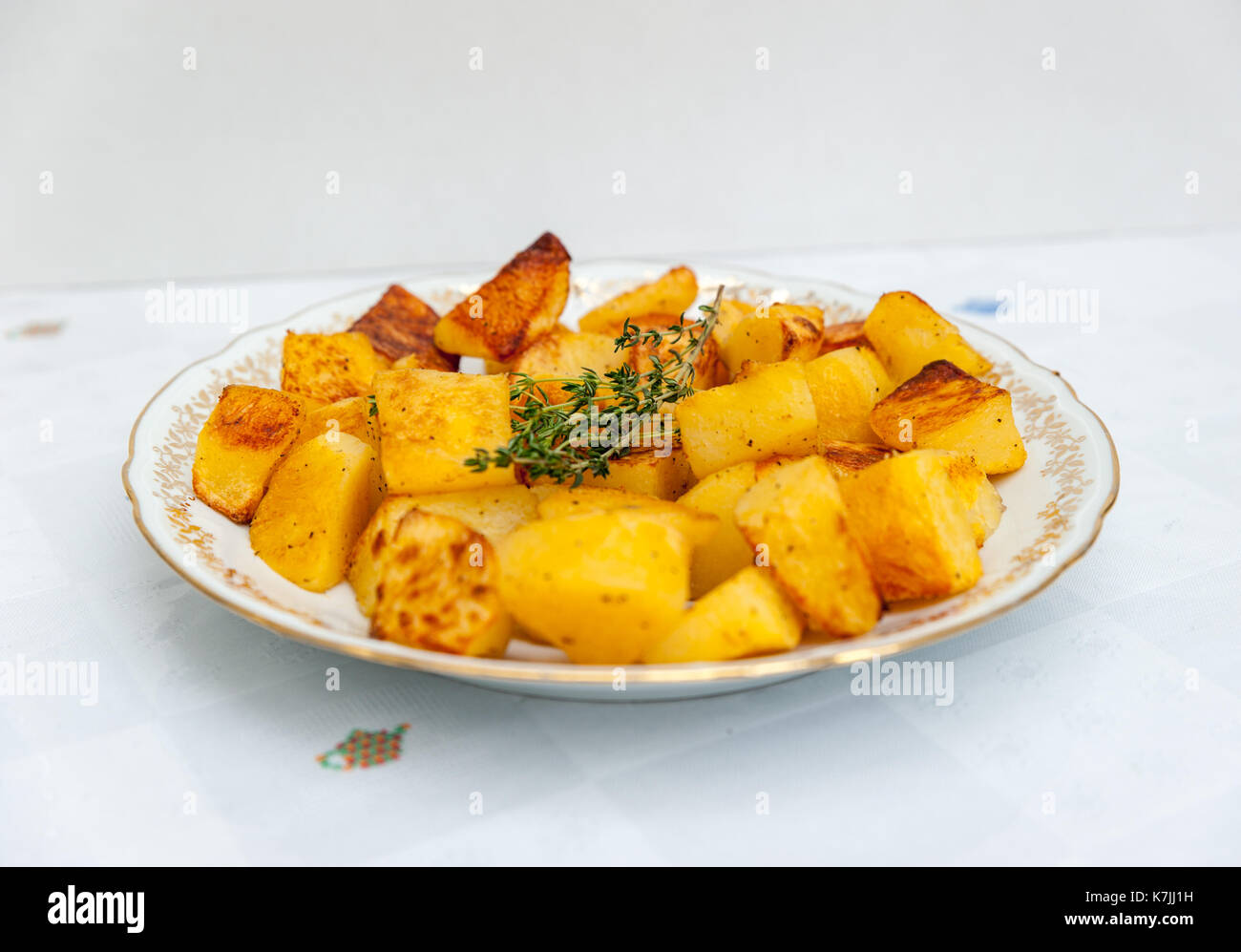 Baked potatoes in a white plate Stock Photo