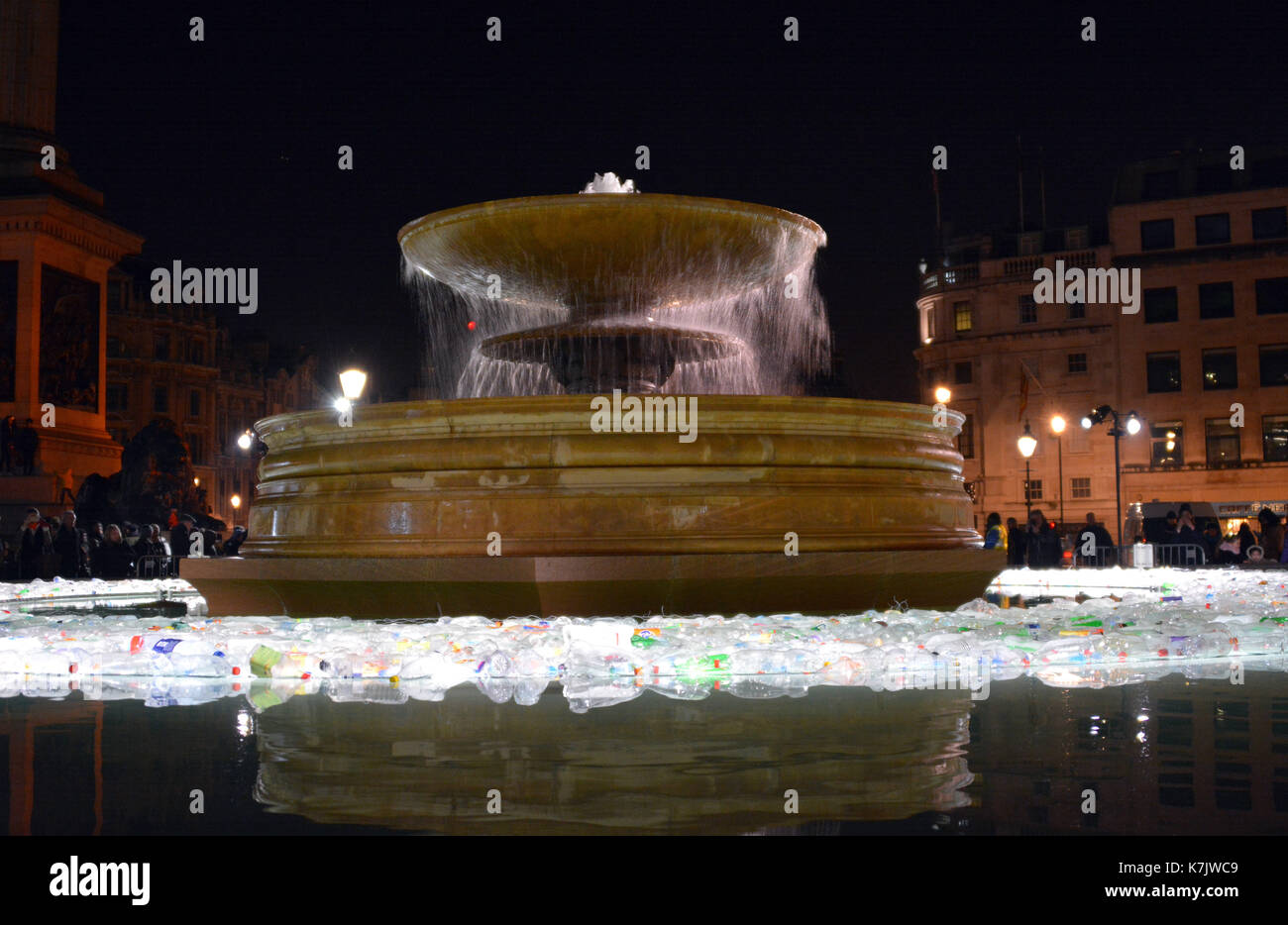 Photo Must Be Credited ©Alpha Press 066465 16/01/2016 Plastic Islands by Luzinterruptus in Trafalgar Square at the Lumiere London Light Festival. Plastic Islands is inspired by the Eighth Continent: the Garbage Patch of marine litter that accumulates in the North Pacific Ocean. It comments on the alarming rate that rubbish is swallowing large areas of the Pacific Ocean and the lack of action to tackle this problem. Made from thousands of bottles, this installation both awakens and astounds audiences with its message. Stock Photo