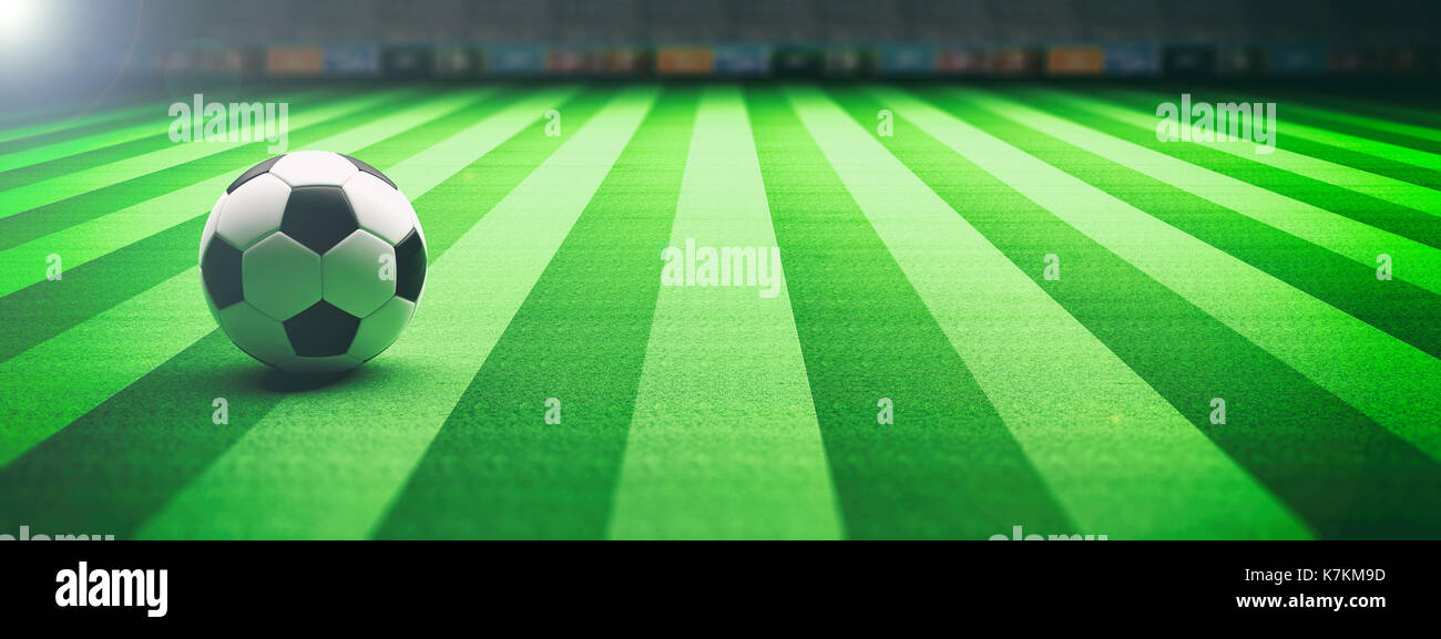 Soccer football ball on an illumunated field grass background. 3d illustration Stock Photo