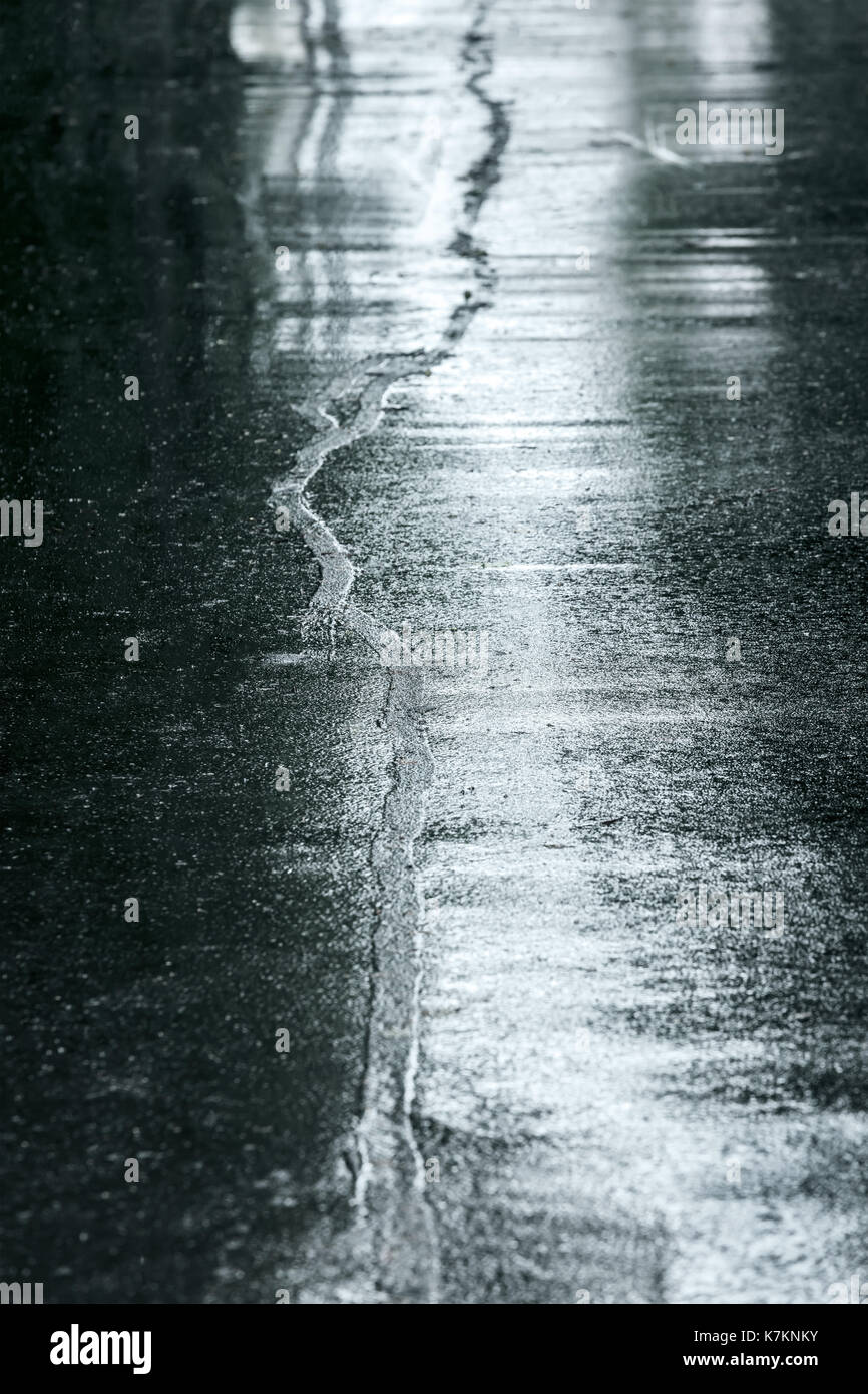 rain puddle on sidewalk