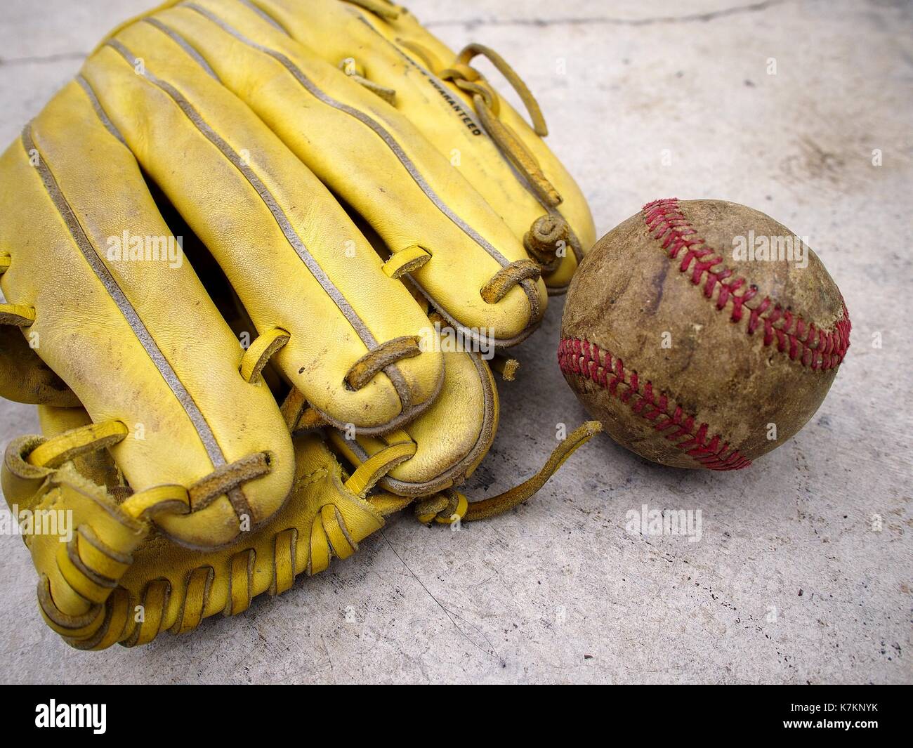 Photo of a baseball gloves and an old baseball Stock Photo Alamy