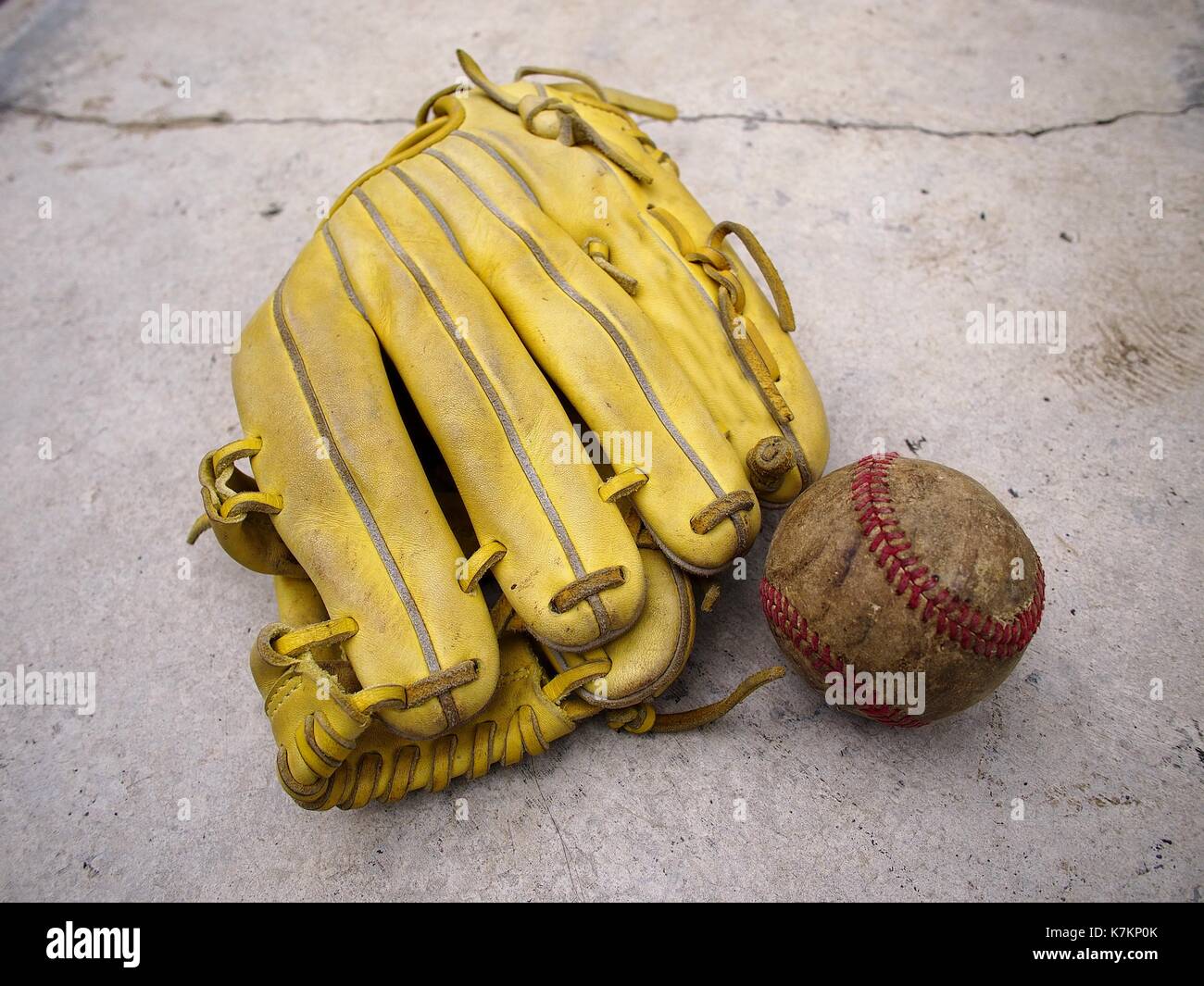 Photo of a baseball gloves and an old baseball Stock Photo Alamy