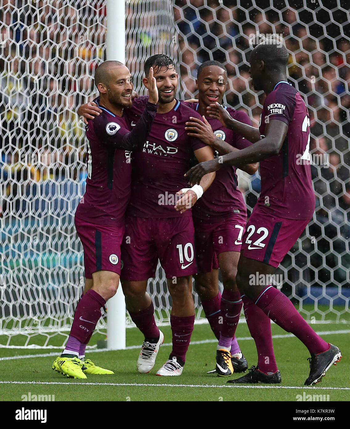 Manchester City's Sergio Aguero (left centre) celebrates with David Silva (left), Raheem Sterling (right centre) and Benjamin Mendy after scoring his side's second goal during the Premier League match at Vicarage Road, Watford. Stock Photo