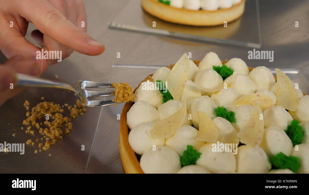 Closeup of whipping cream cake decoration. Delicious white cream cake