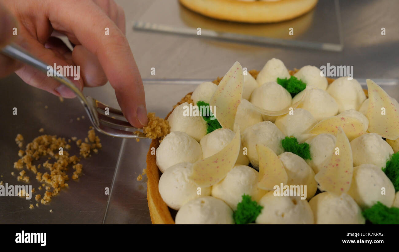 Closeup of whipping cream cake decoration. Delicious white cream cake