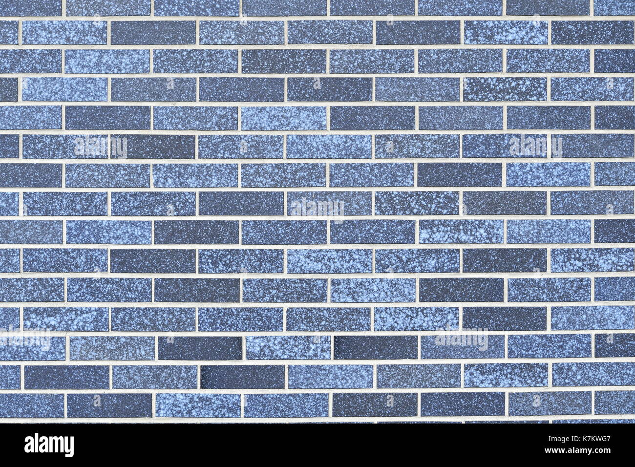 horizontal background of brick wall built of blue bricks Stock Photo