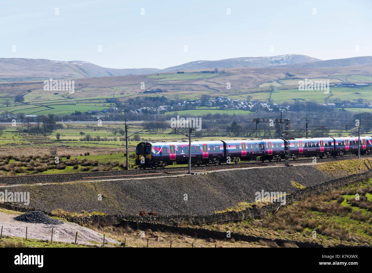 Class 350 electric multiple unit (emu) passenger train operated by FirstTransPennine Express, passing Tebay as it ascends Shap on March 25th 2017, hea Stock Photo