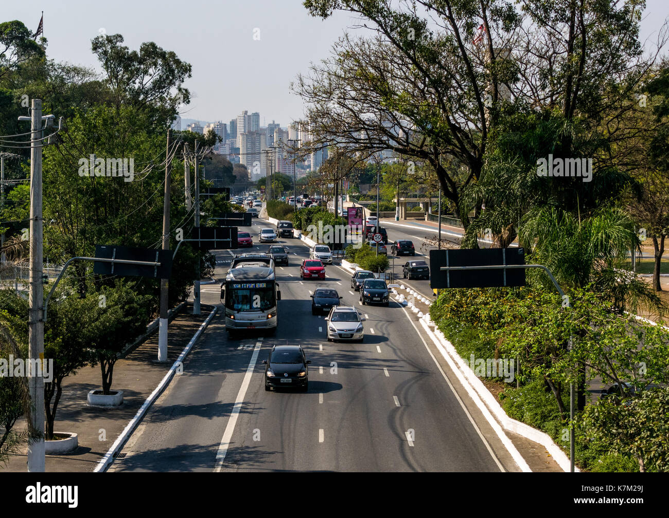 Brazil, Sao Paulo, September 16 2017 - Large road / avenue downtown, with incoming traffic, and city skyline background Stock Photo