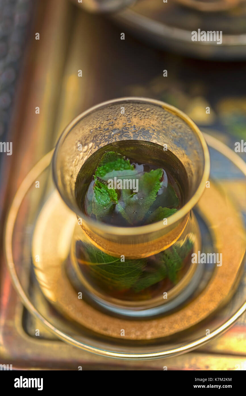 Lebanese mint tea in golden glass Stock Photo Alamy