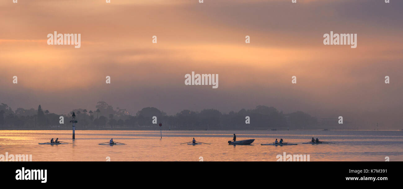 A university rowing club on the Swan River at sunrise. Stock Photo